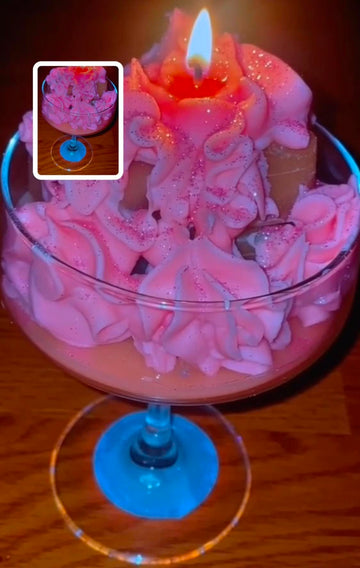 Pink Whip Glitter Candle in an elegant glass with blue base